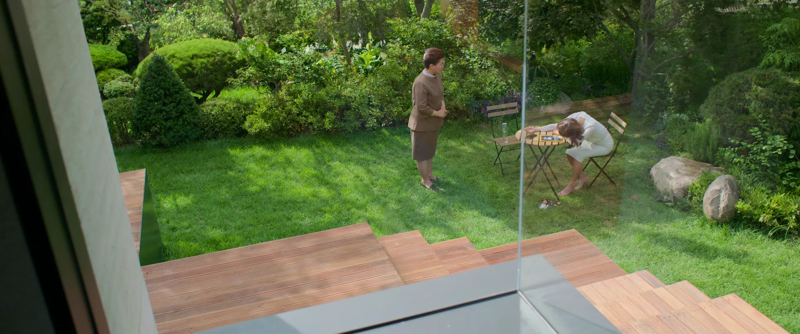 Mrs. Park asleep at the garden table in full sun