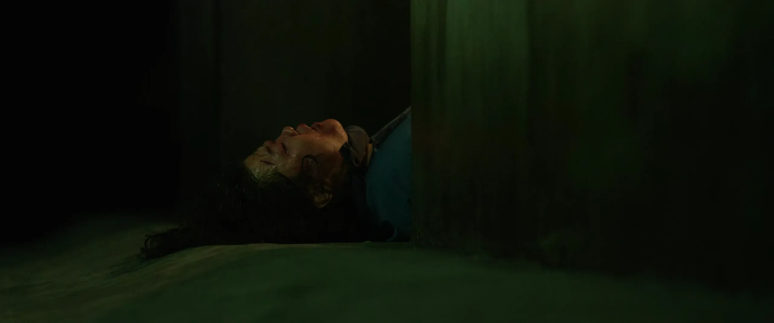 Moon-gwang collapsed on the floor of the bunker during the flood sequence.