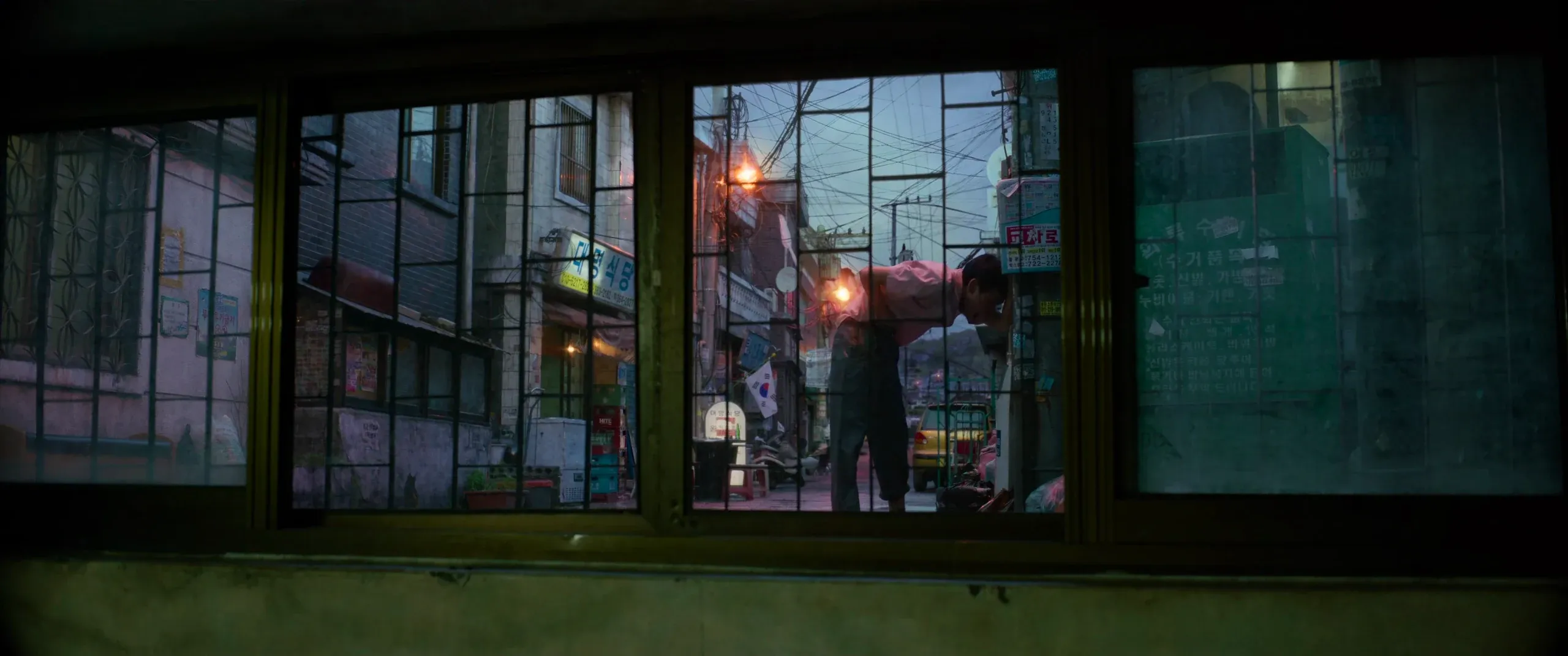 A drunk man urinating outside the Kims’ street-level window